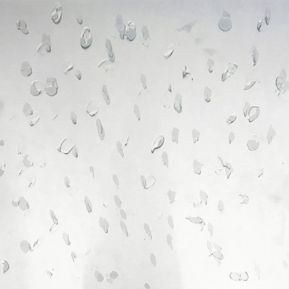 Acrylic teardrops on aluminum surface