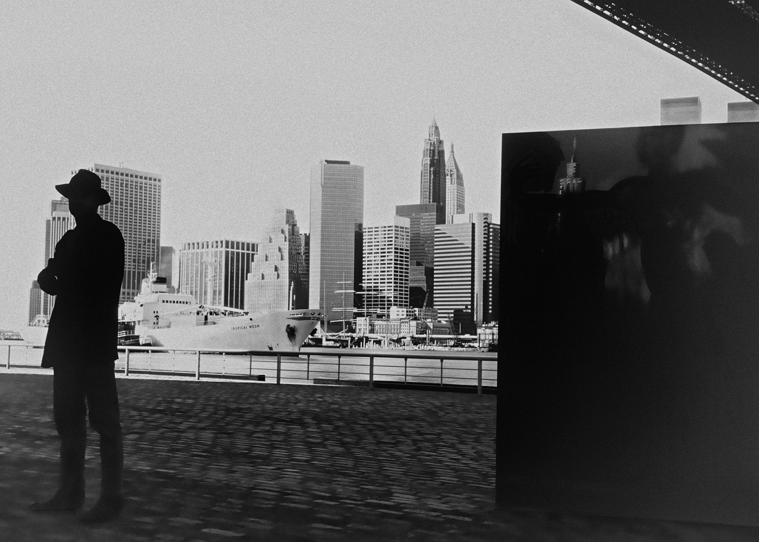 silhouette of artist under the Brooklyn Bridge