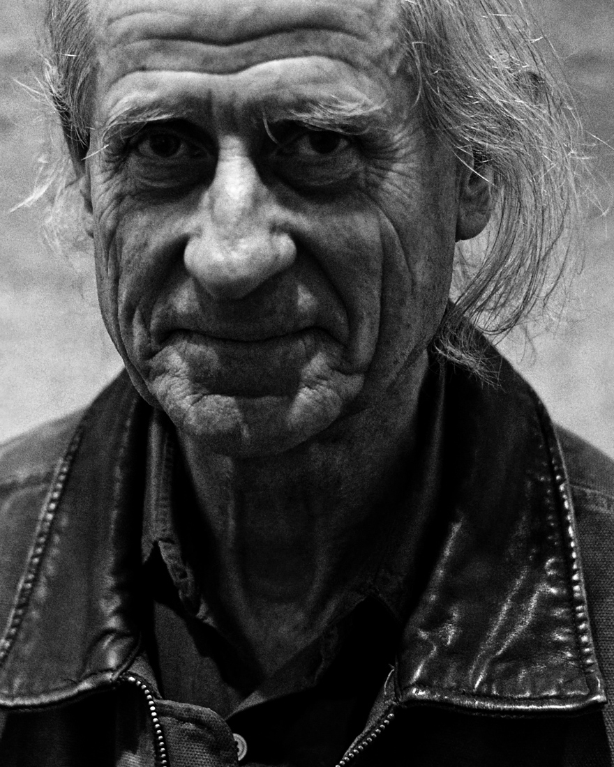 frontal portrait of artist wearing a leather jacket